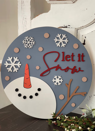This beautiful 16" round canvas Let It Snow Snowman sign makes a great added decor piece to any home, or as a gift.  All elements are 3D cutouts.  Not intended to be used in direct line of outdoor elements.