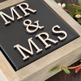 This image is a close up of the 3D lettering.This sign is black with white lettering.