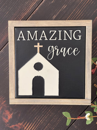 This image shows the sign Amazing Grace with a church, all in 3D cutouts.  A stained frame has been added to the canvas sign.