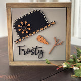 This image shows the Frosty sign standing up on a bench.