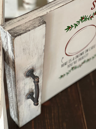 This image shows the side of the tray and the dark metal handles.