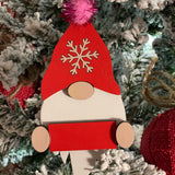 This is the red gnome hanging on a tree.