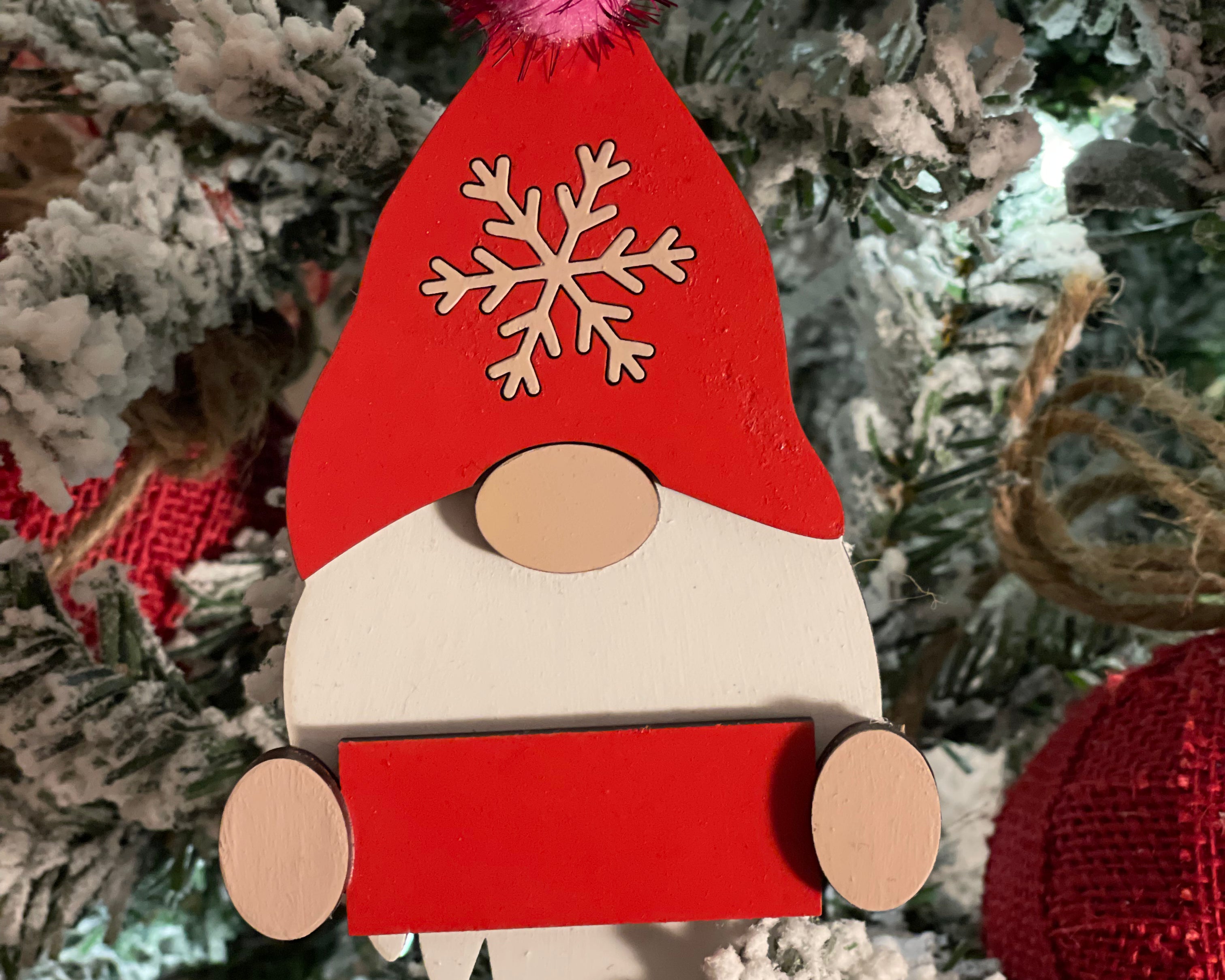 This is the red gnome hanging on a tree.