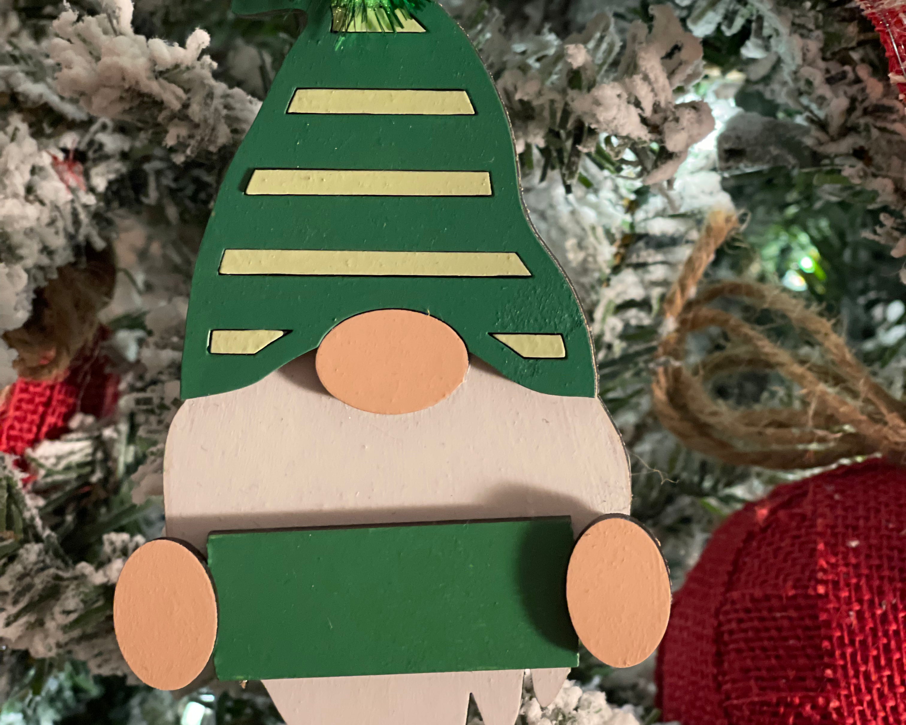 This is the green gnome hanging on a tree