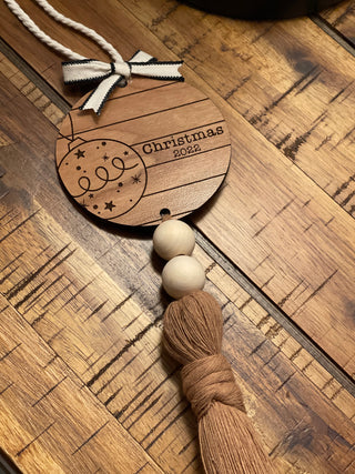 This ornament is displayed on a wood table.