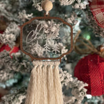 This image shows the ornament hanging on a tree.