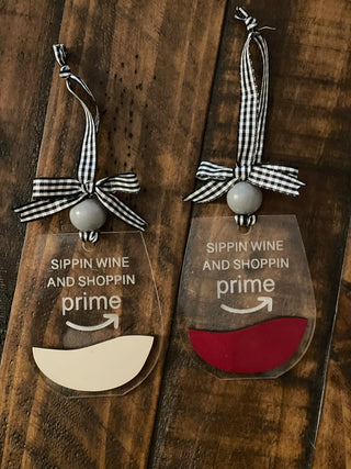 This image shows the engraved writing and the two acrylic ornaments side by side.
