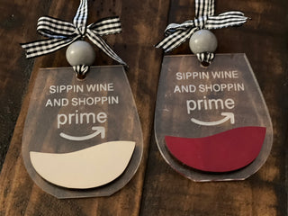 This image shows the two red and white acrylic ornaments side by side.