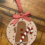 The ornament is displayed laying on a wood table.
