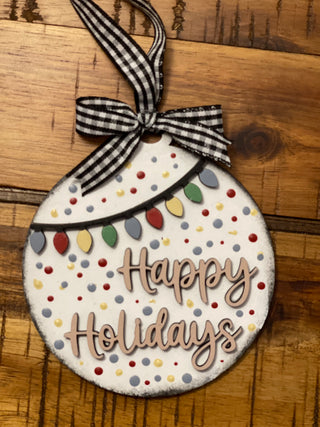 This ornament is displayed on a wood table.