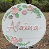 Nursery Baby Name Sign is shown displayed outside on an easel so you can see the colors of the 3D wood.