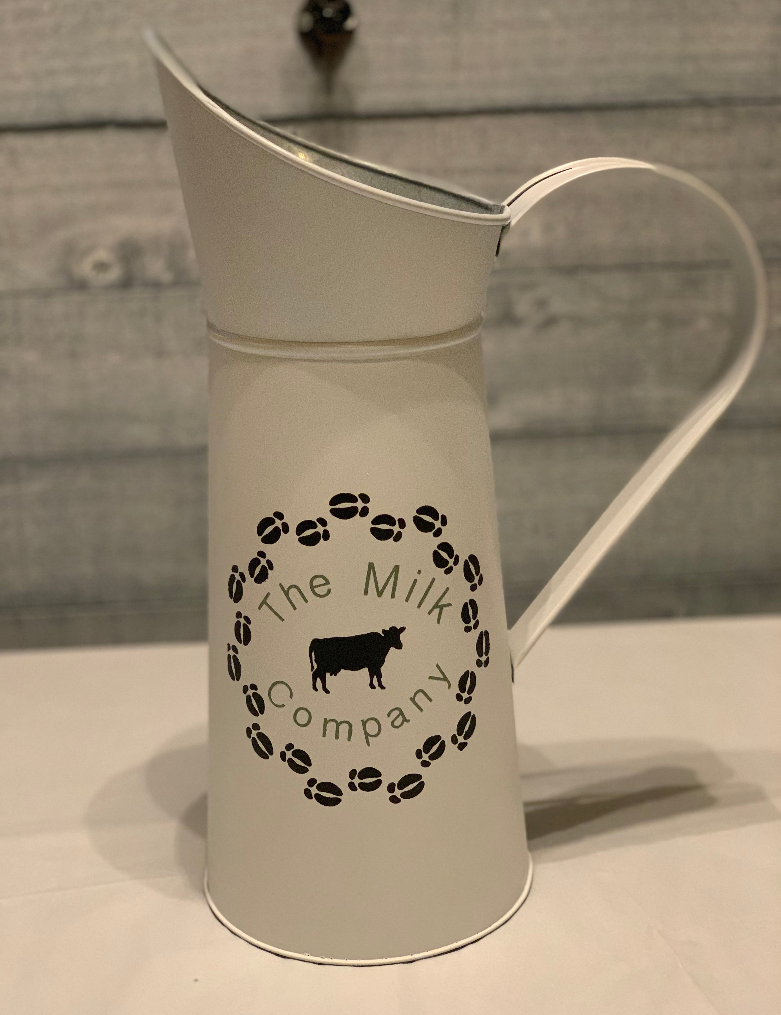 Vintage White Milk Pitcher displaying The Milk Company on the side