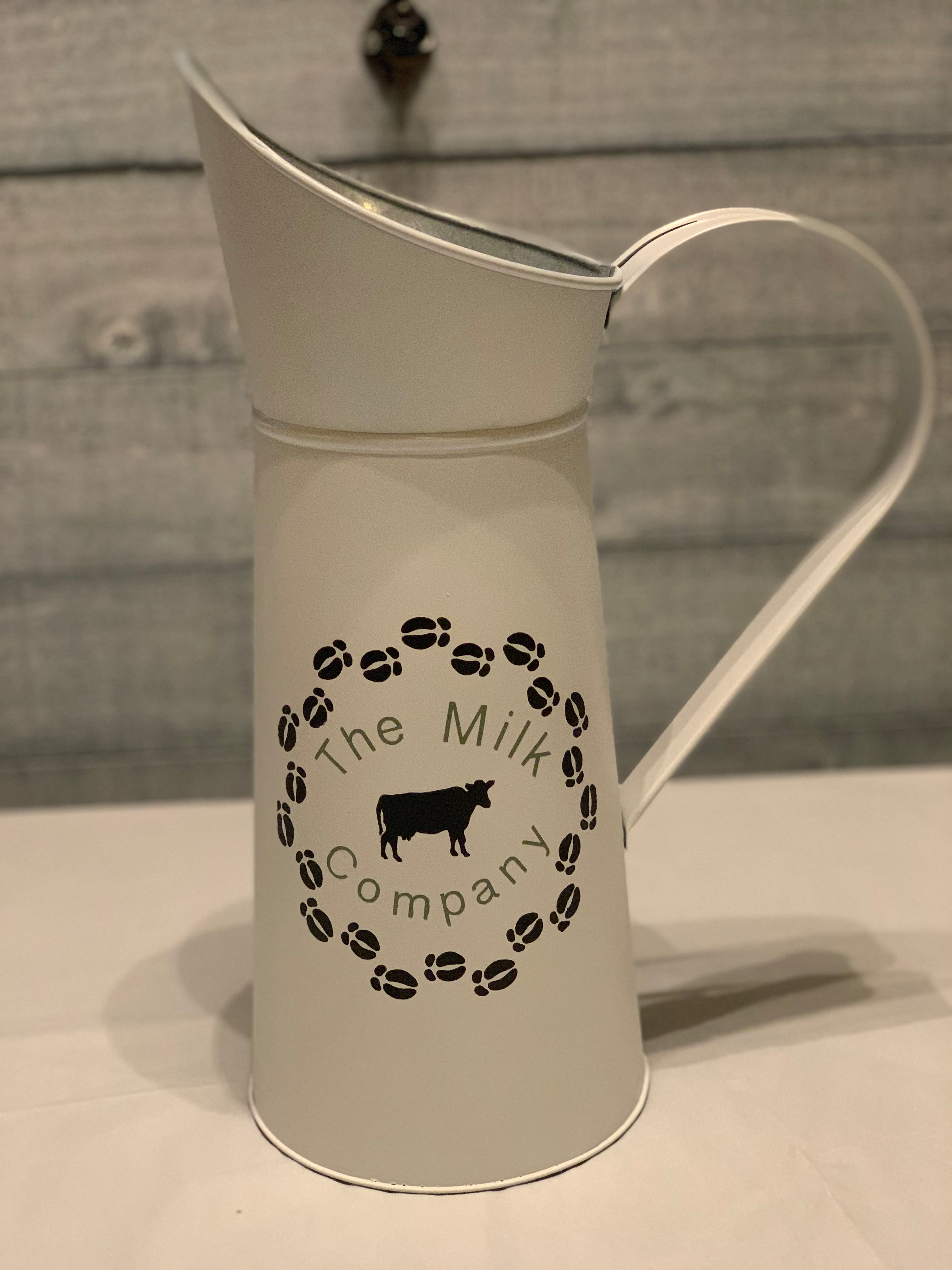 Vintage White Milk Pitcher displaying The Milk Company on the side