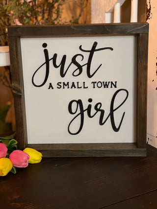 This sign has 3D wood letters with a stained frame.