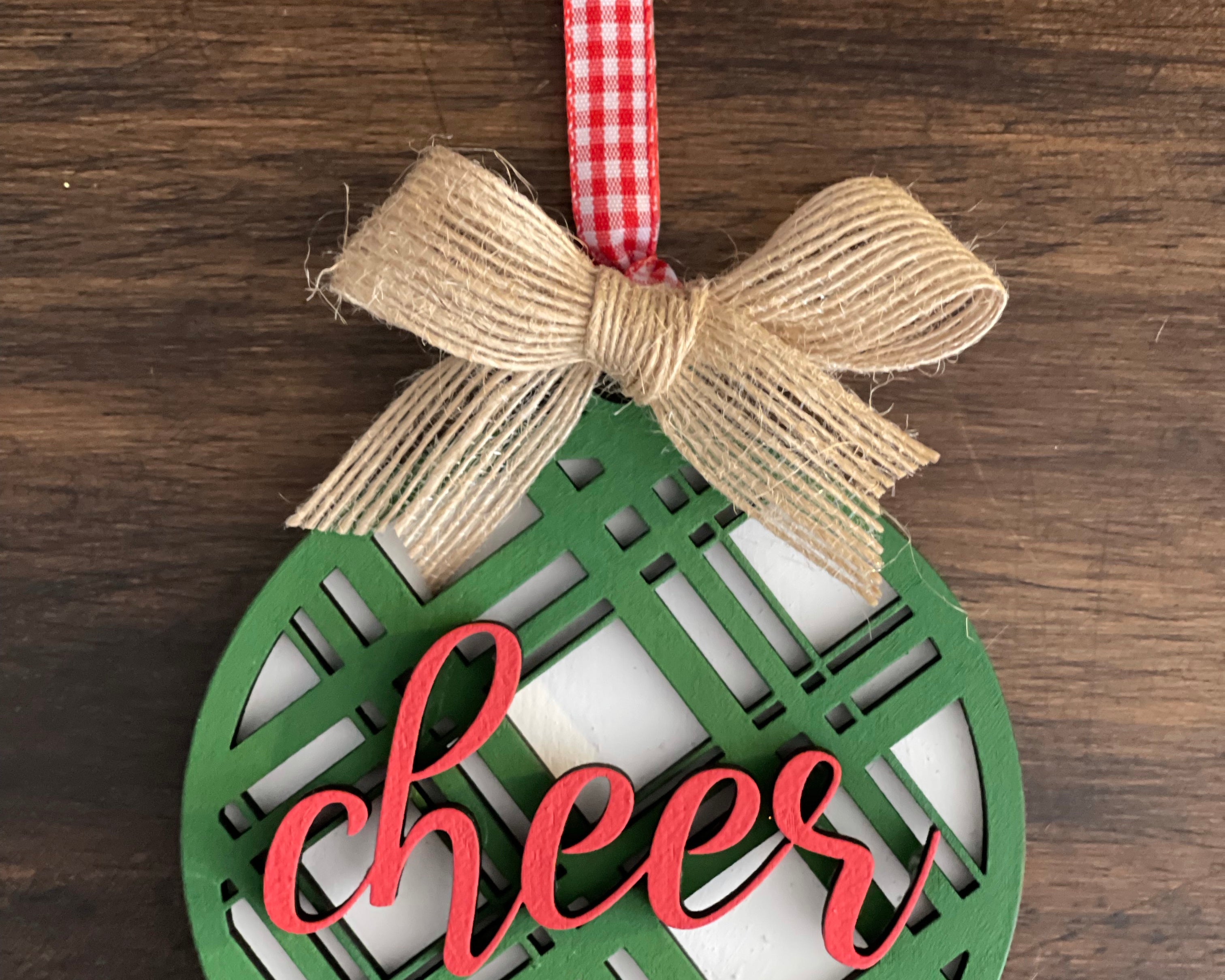 This is the green cheer plaid ornament with a twine bow.