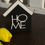 This image show the black HOME sign.