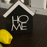 This image show the black HOME sign.