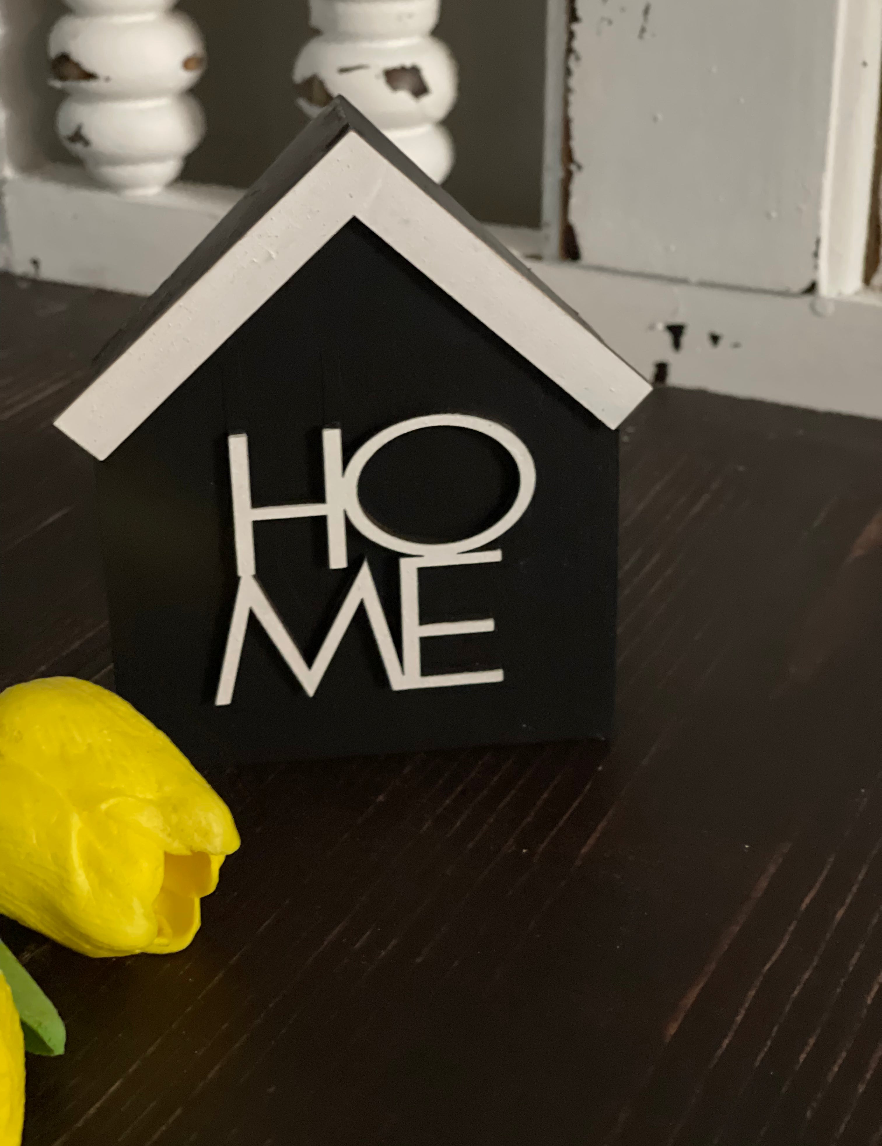 This image show the black HOME sign.