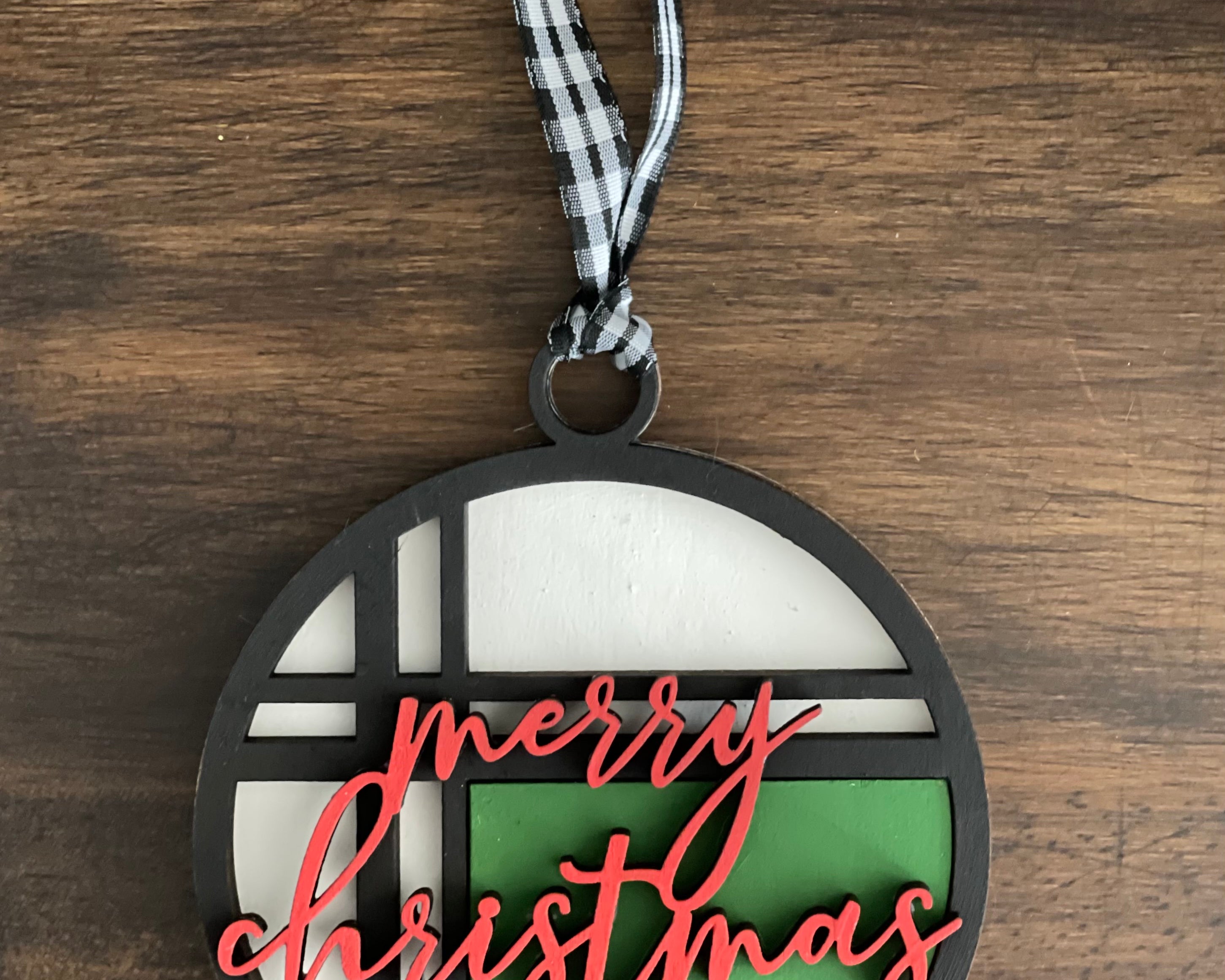 This is the red, green, white and black Merry Christmas ornament without a twine bow.