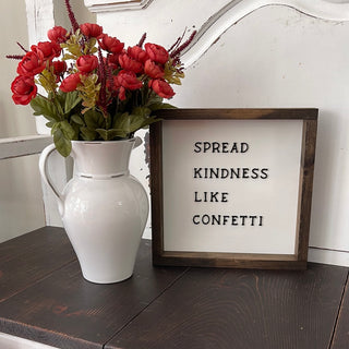 this image shows rhr pitcjer with a floral arrangemwnt next to oir wooden sign. wood sign not included with the pitcher. 