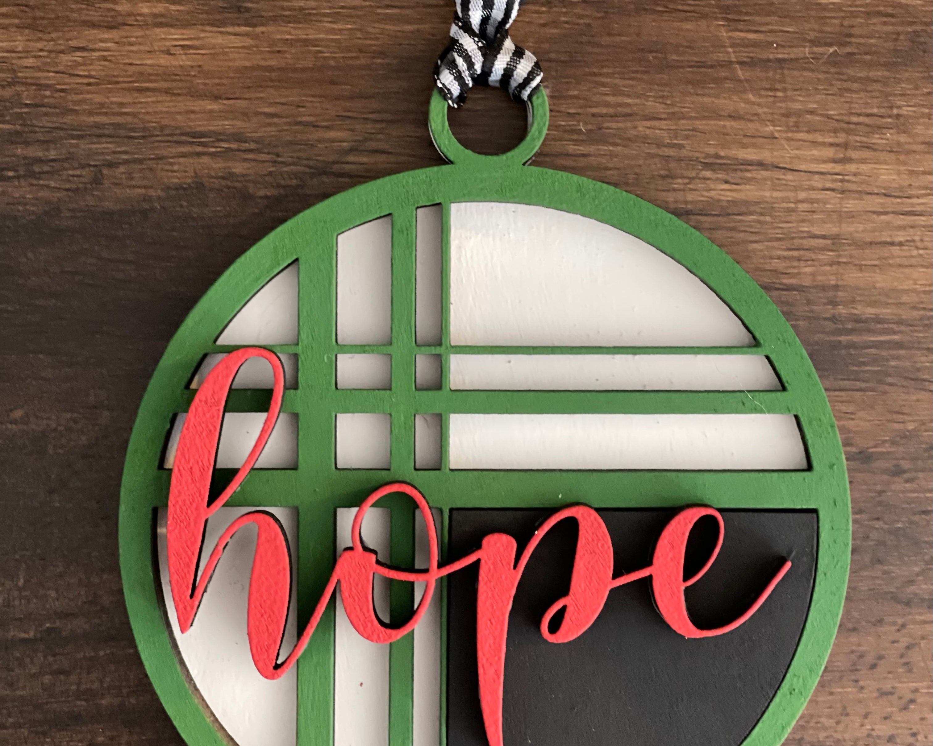 This is the red, green, black and white hope ornament without a twine bow.