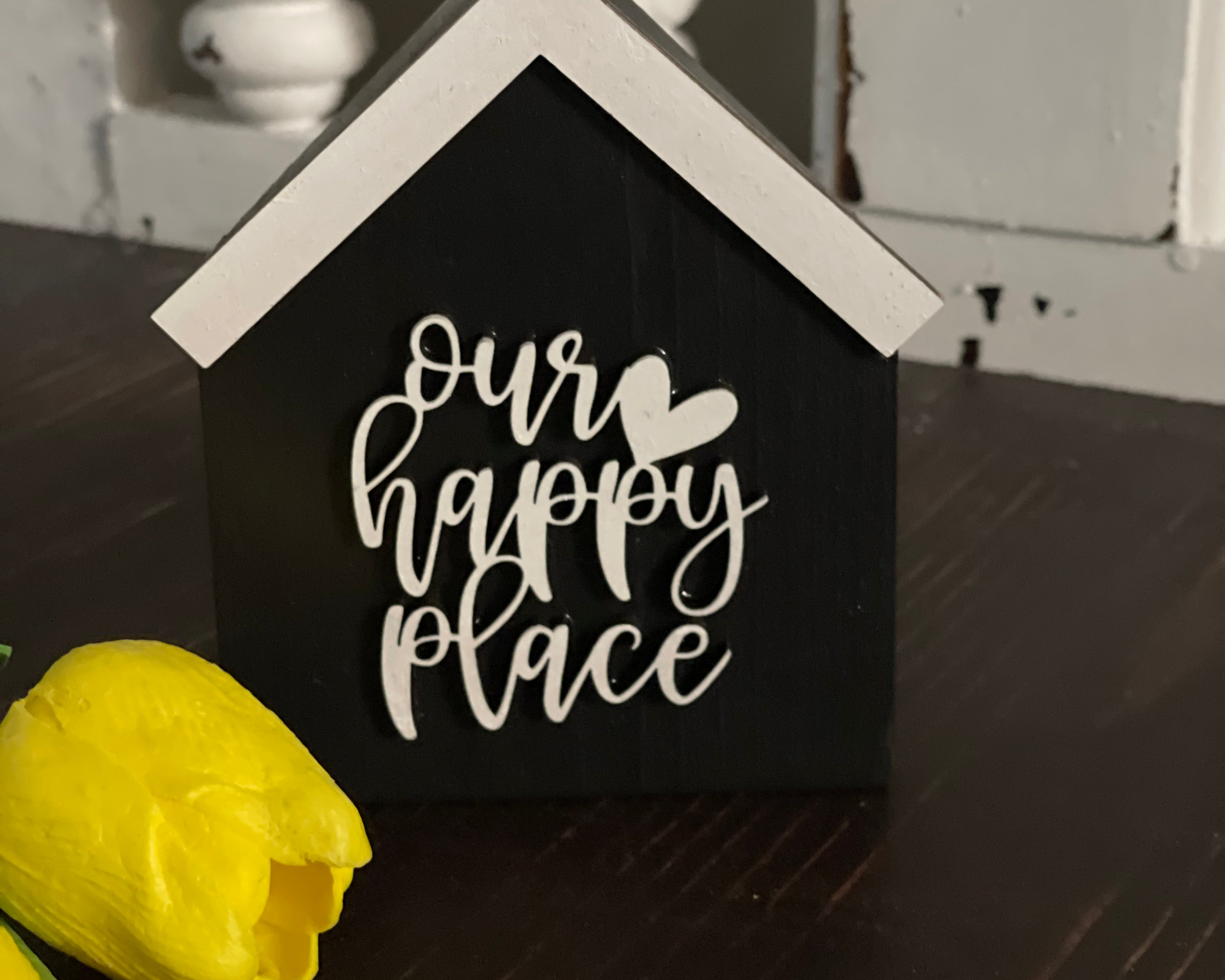 This image shows the black Our Happy Place. 