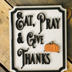 This image show the Eat, Pray & Give Thanks mini sign with a 3D orange pumpkin cutout.
