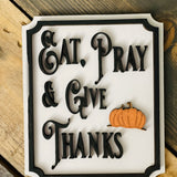 This image show the Eat, Pray & Give Thanks mini sign with a 3D orange pumpkin cutout.