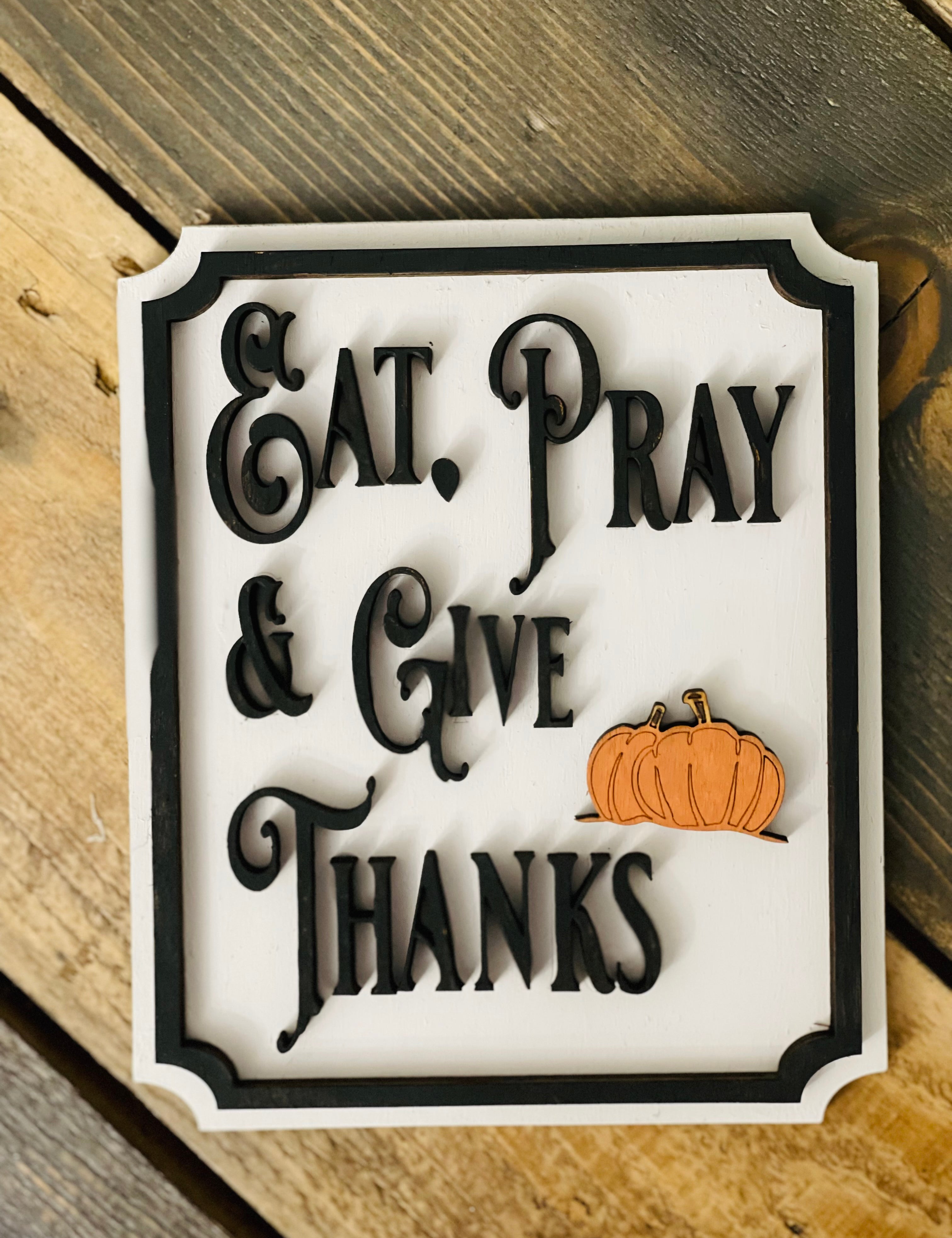 This image show the Eat, Pray & Give Thanks mini sign with a 3D orange pumpkin cutout.