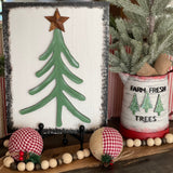 This image shows the pine tree paired with our 3D wood cutout Christmas tree with a metal star.  Each are sold separately.  