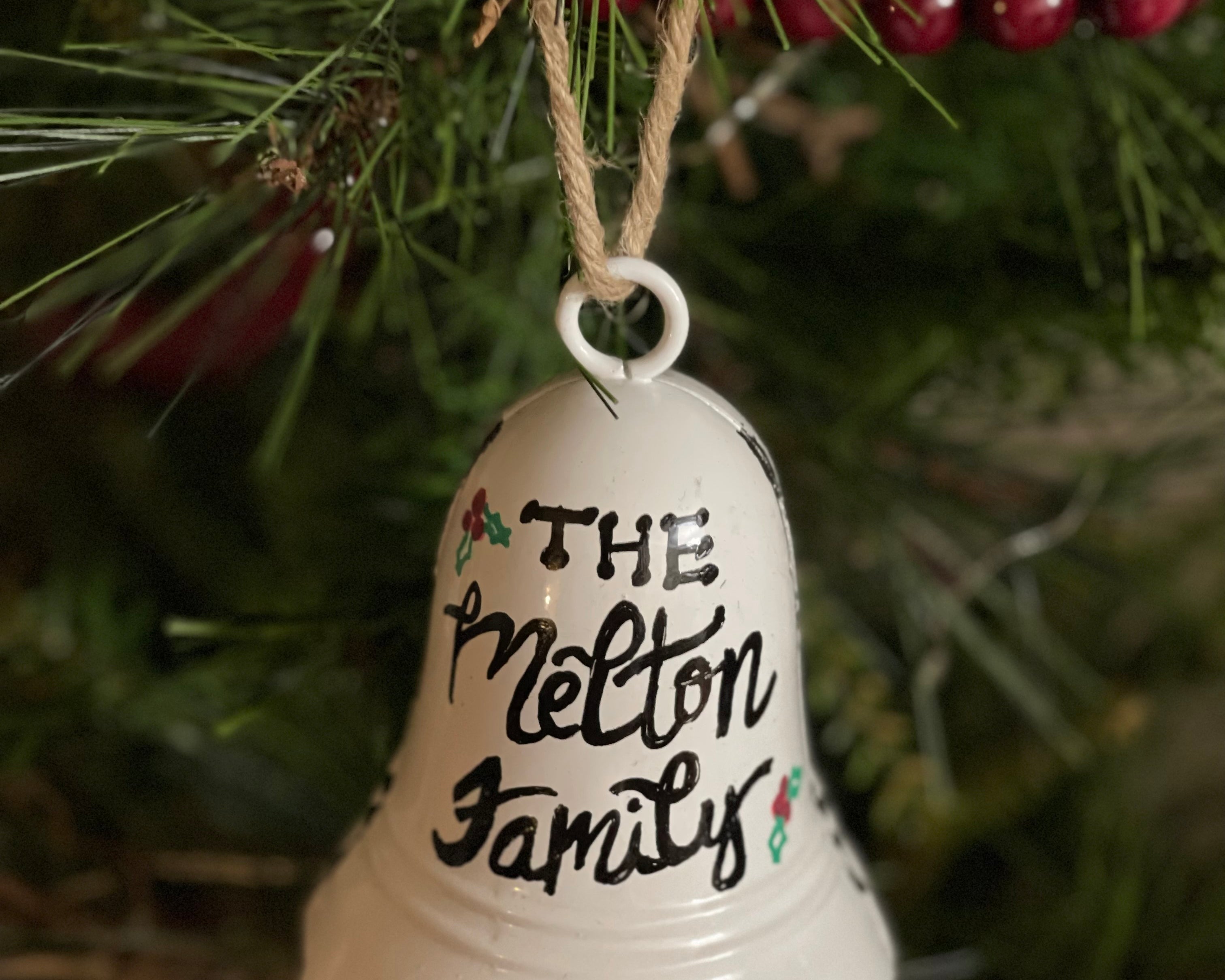 This fully customizable white bell can have a sing name, family name or any saying hand lettered.  Writing will be in black, red, or green.
