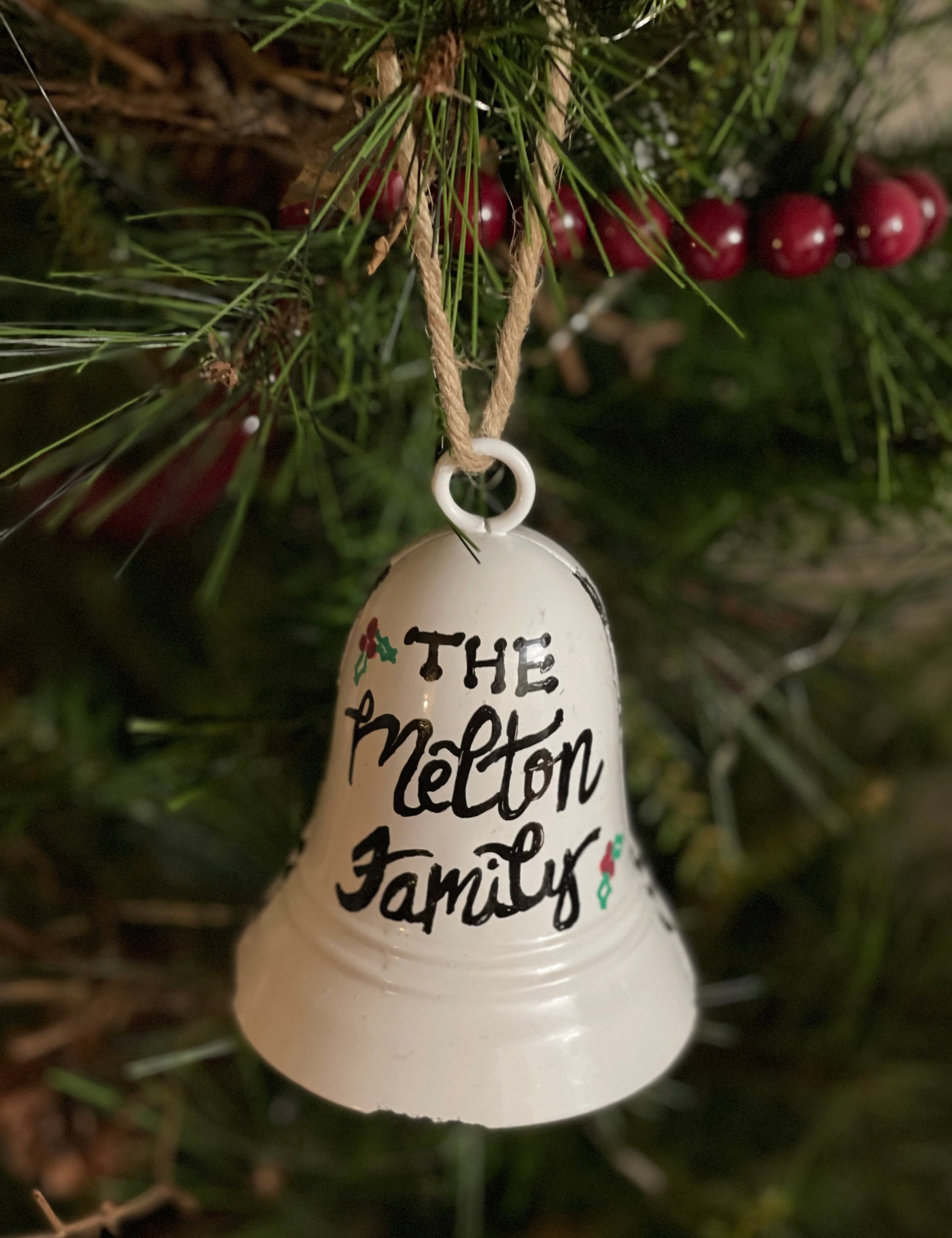 This fully customizable white bell can have a sing name, family name or any saying hand lettered.  Writing will be in black, red, or green.