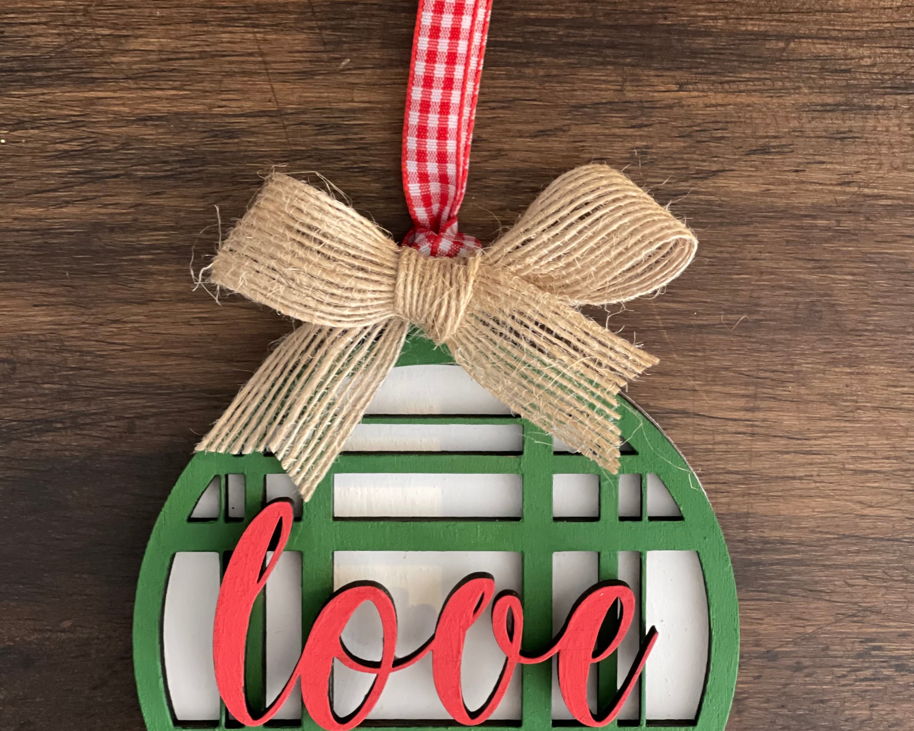 This is the green plaid love ornament with a twine bow.