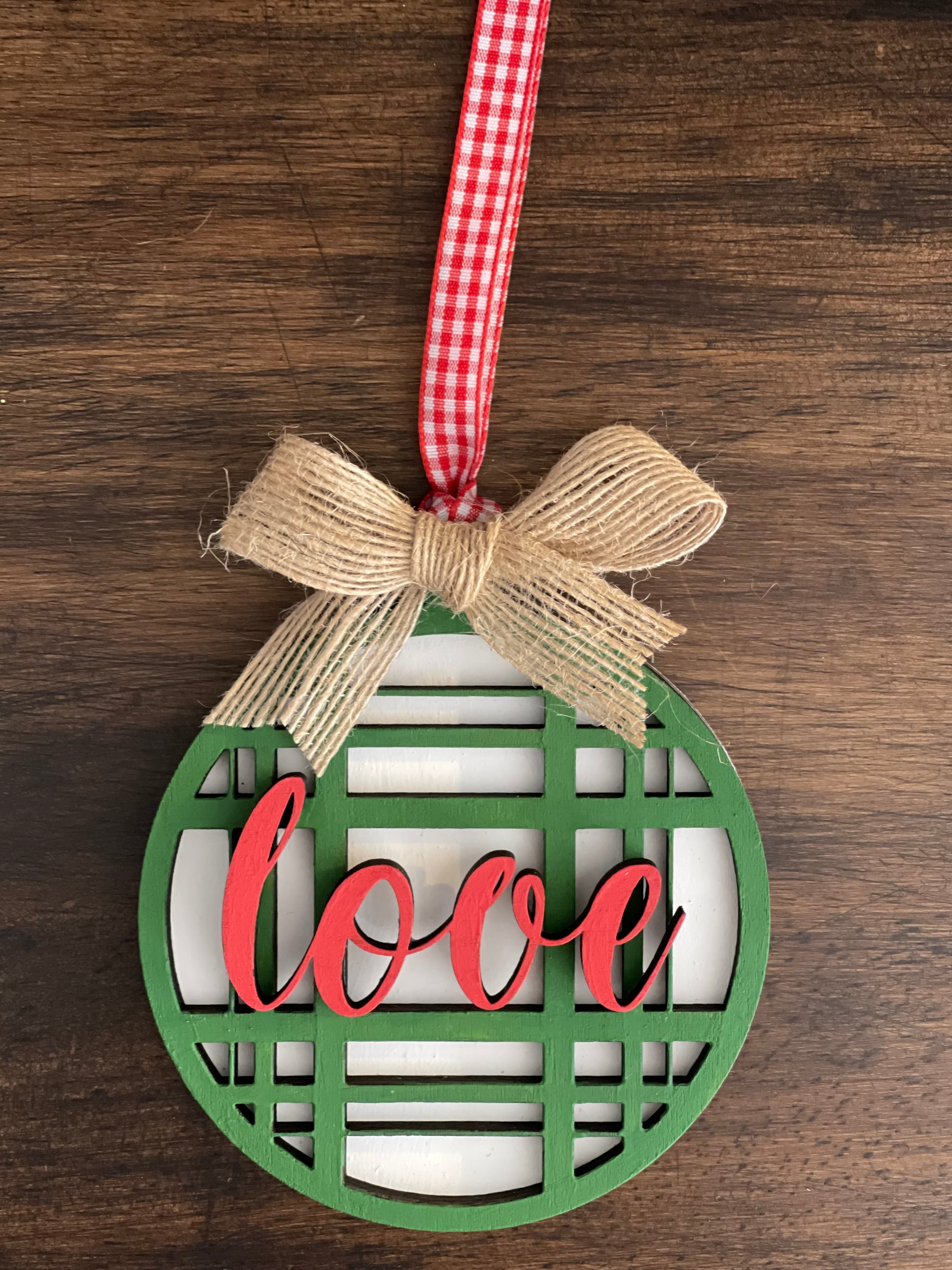 This is the green plaid love ornament with a twine bow.