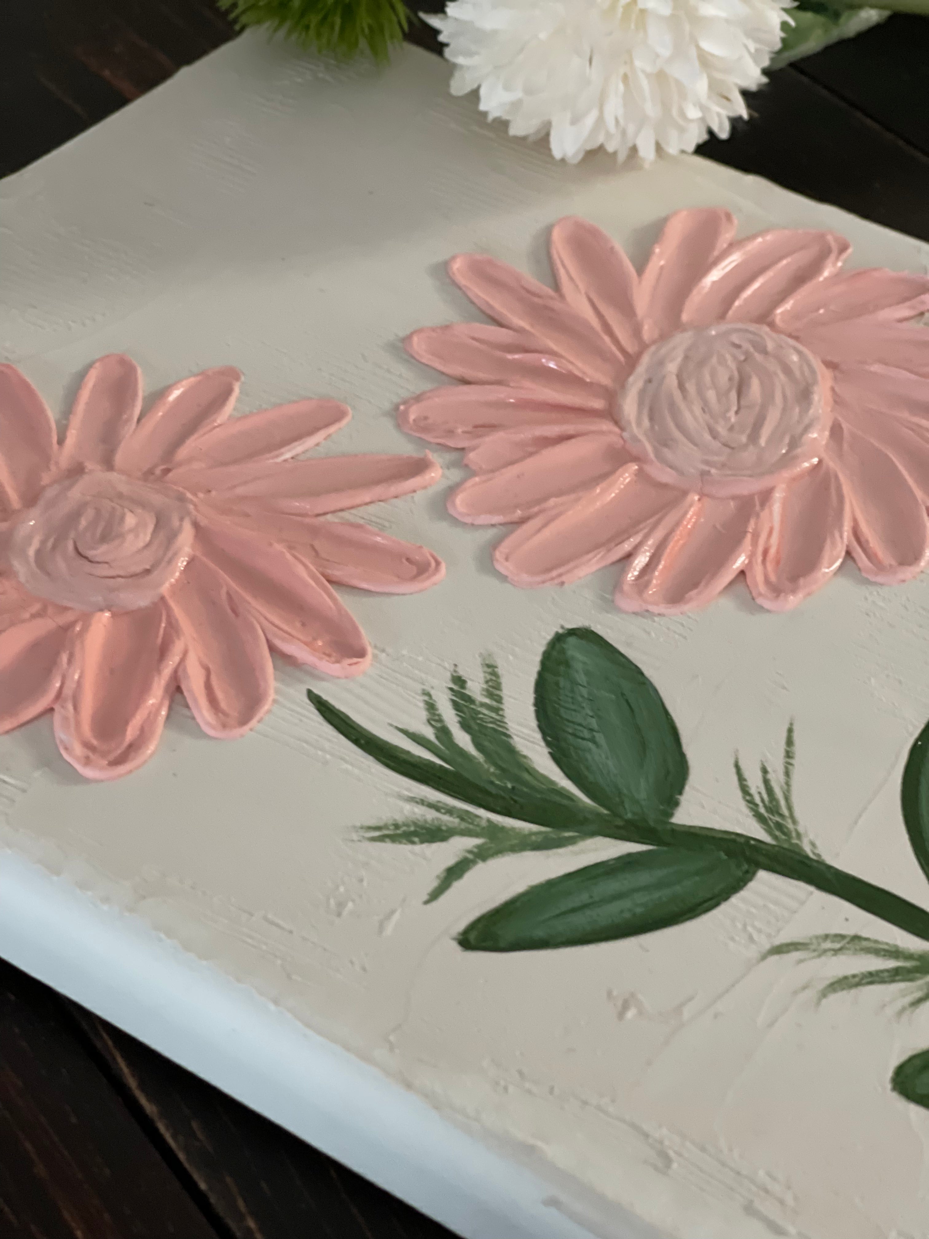 This image shows a close up of the floral design. 