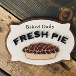 This image show the baked daily fresh pie laser engraved and 3D sign.