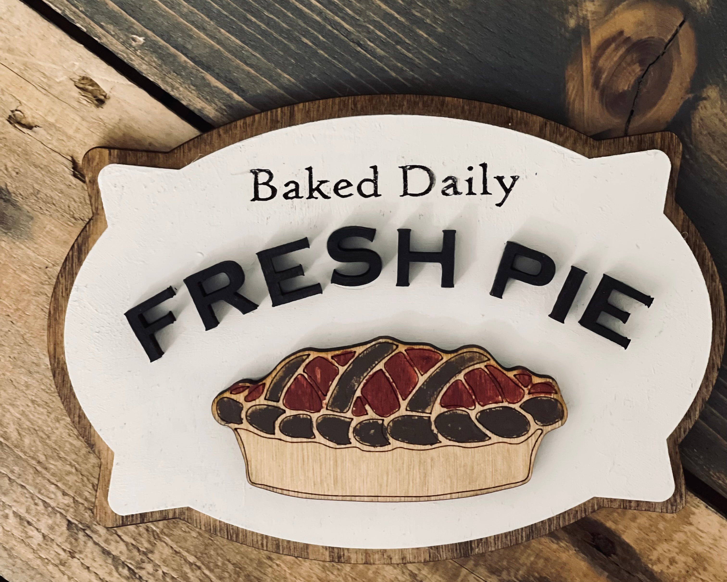 This image show the baked daily fresh pie laser engraved and 3D sign.
