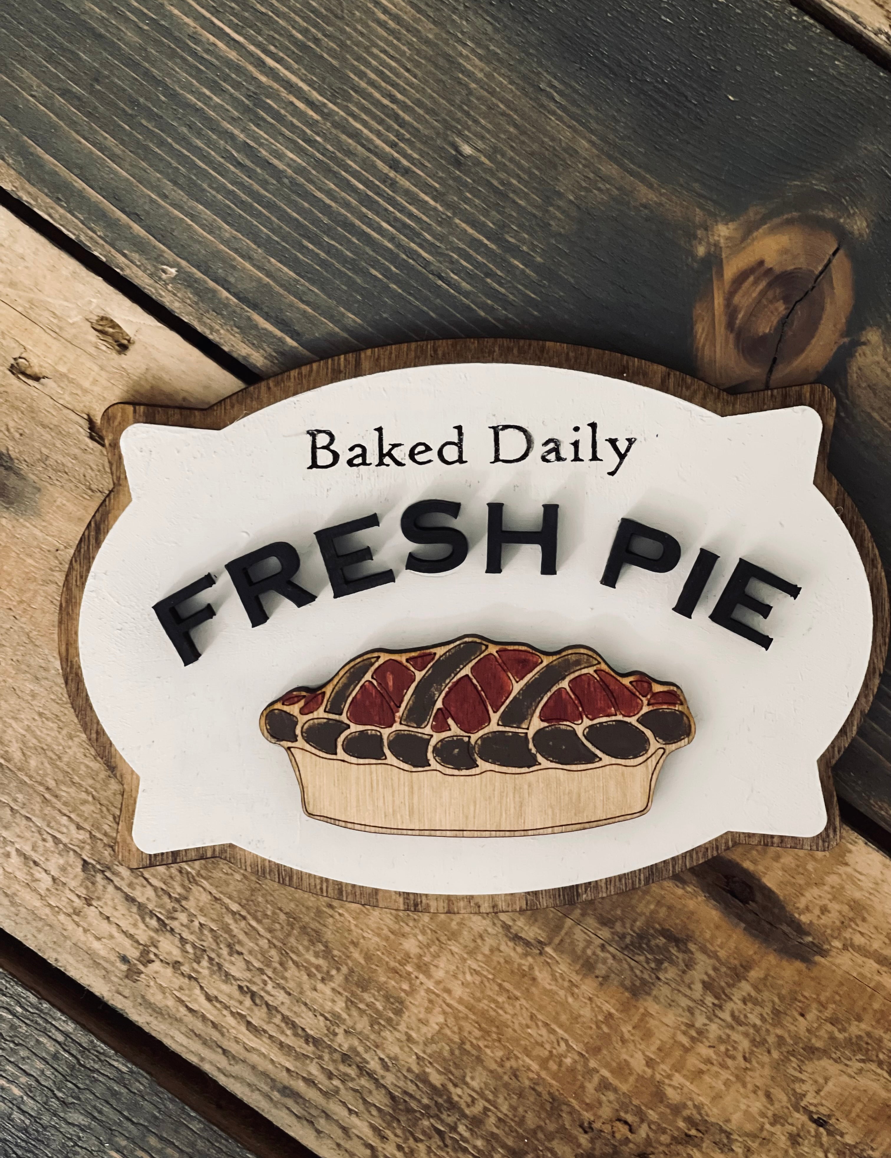 This image show the baked daily fresh pie laser engraved and 3D sign.