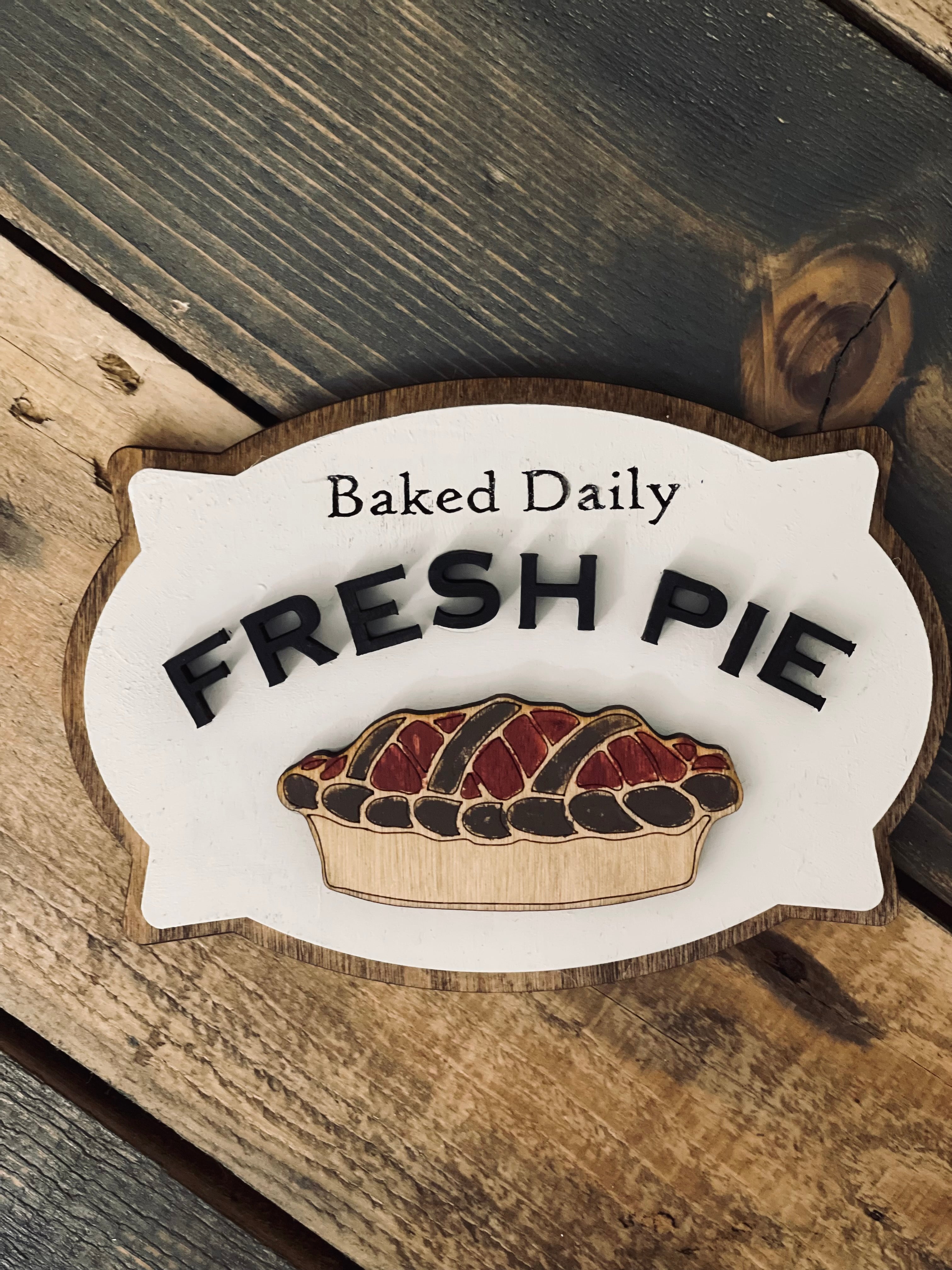 This image show the baked daily fresh pie laser engraved and 3D sign.