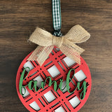 This is the red plaid family ornament with a twine bow.
