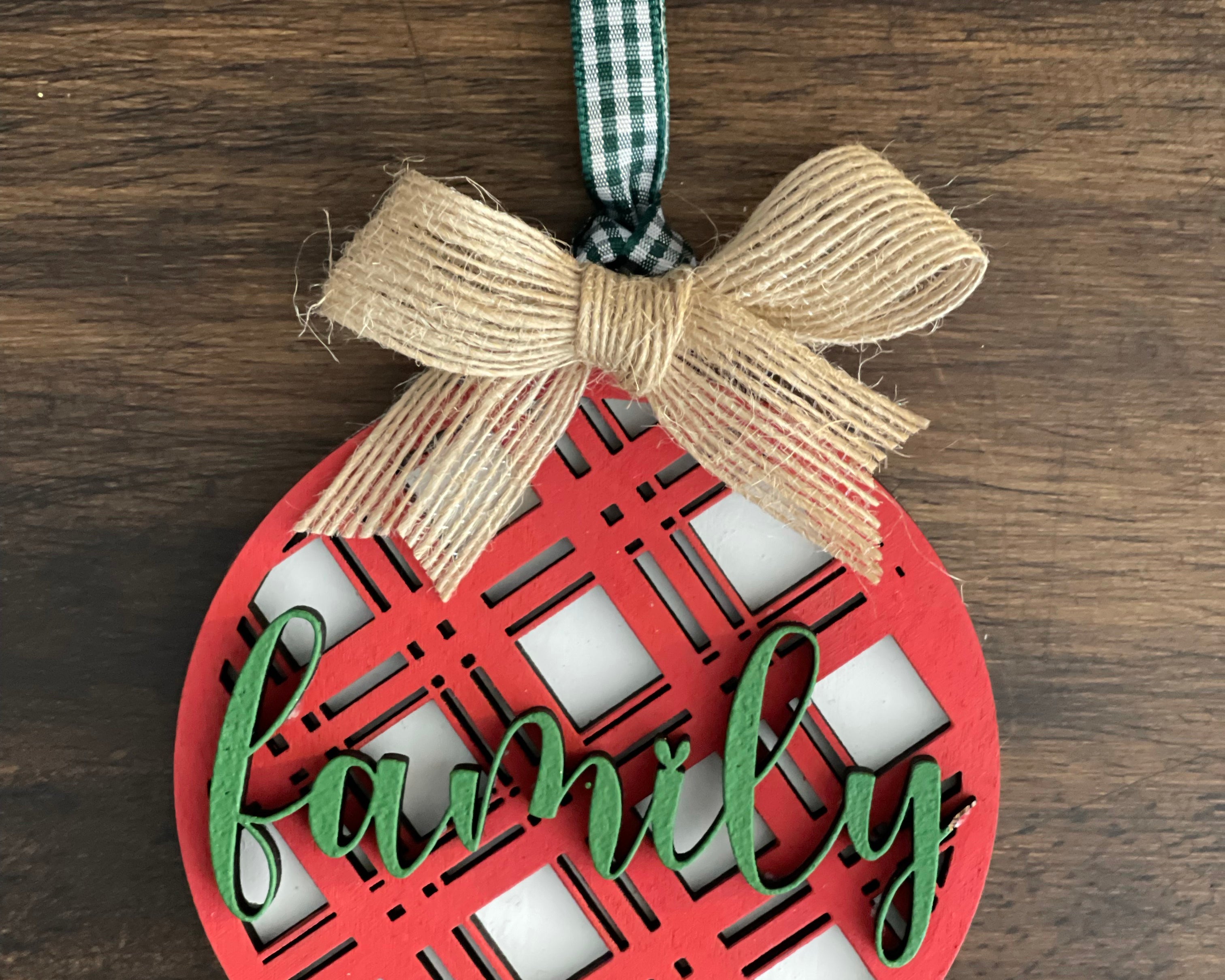 This is the red plaid family ornament with a twine bow.