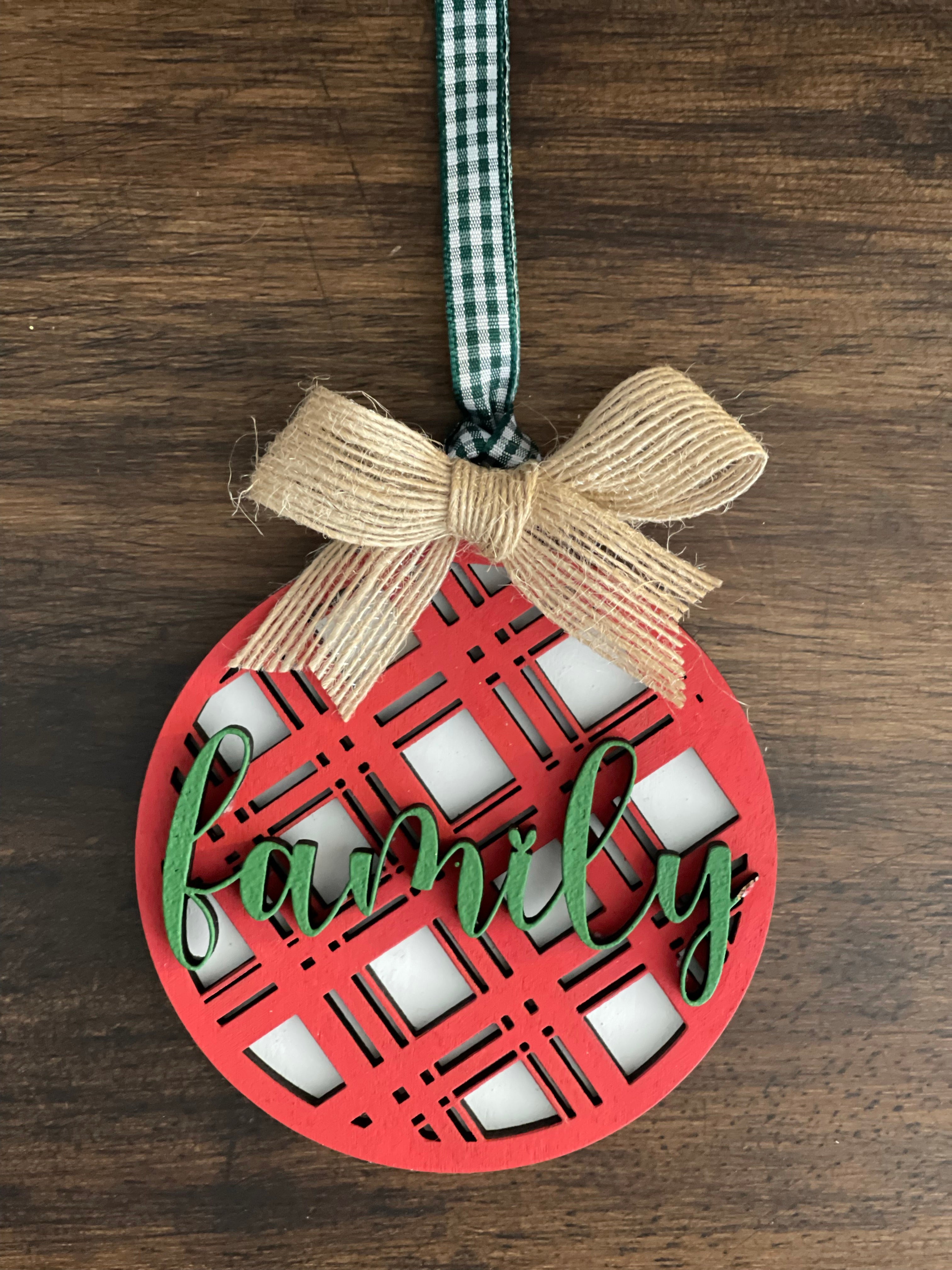 This is the red plaid family ornament with a twine bow.