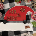 This santa hat says Mr. & Mrs.