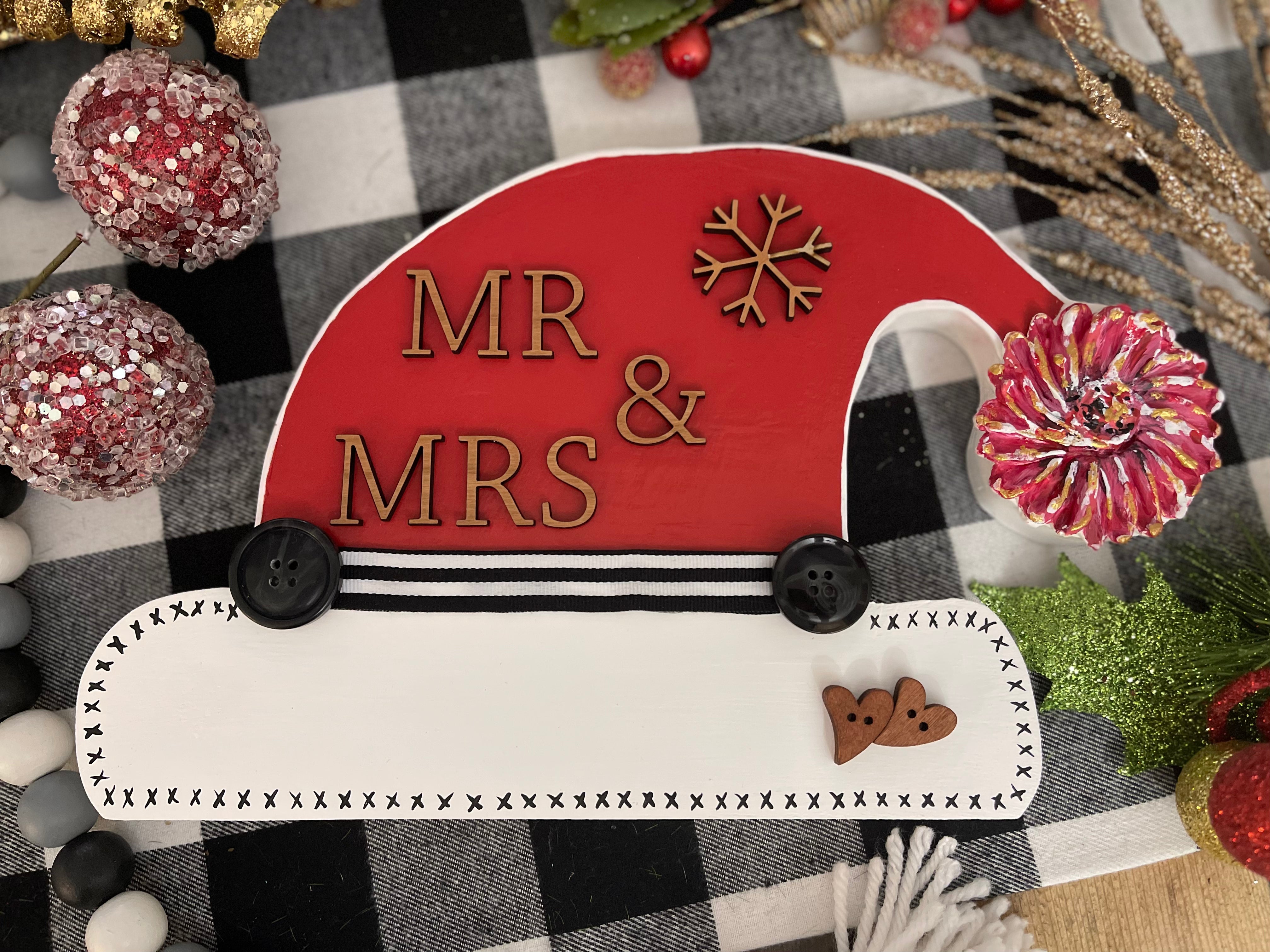 This santa hat says Mr. & Mrs.