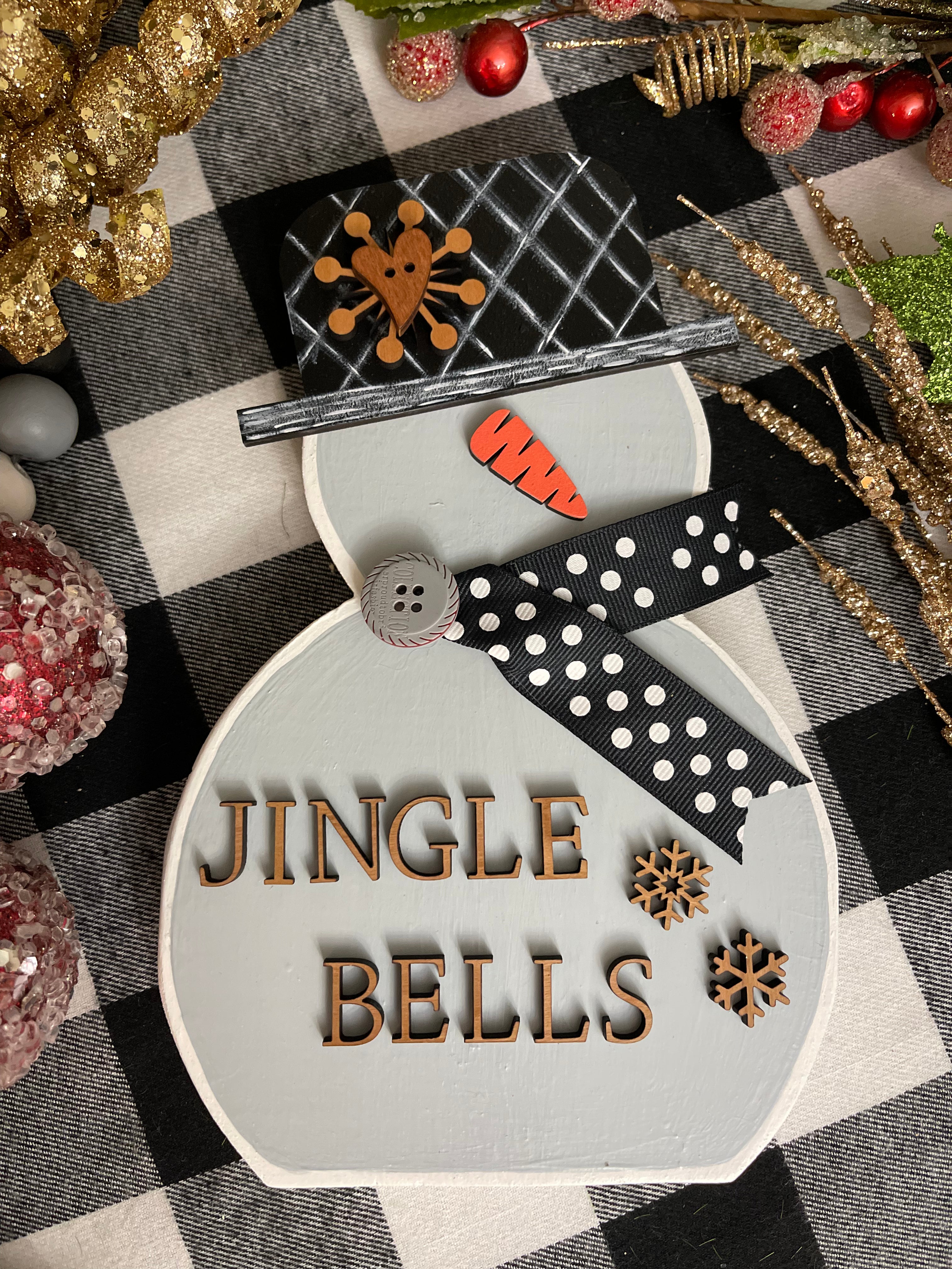 This image shows the small gray snowman that says jingle bells.