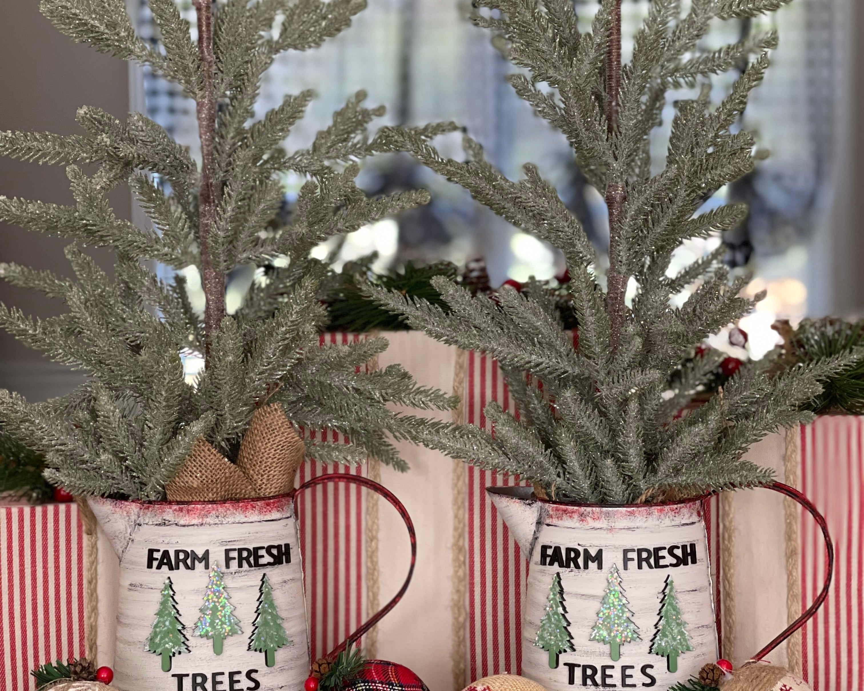 These beautiful hand made trees have hand painted metal pitchers with 3D wood cutouts that say Farm Fresh Trees with 3 wood cutouts pine trees.  They are absolutely stunning. 