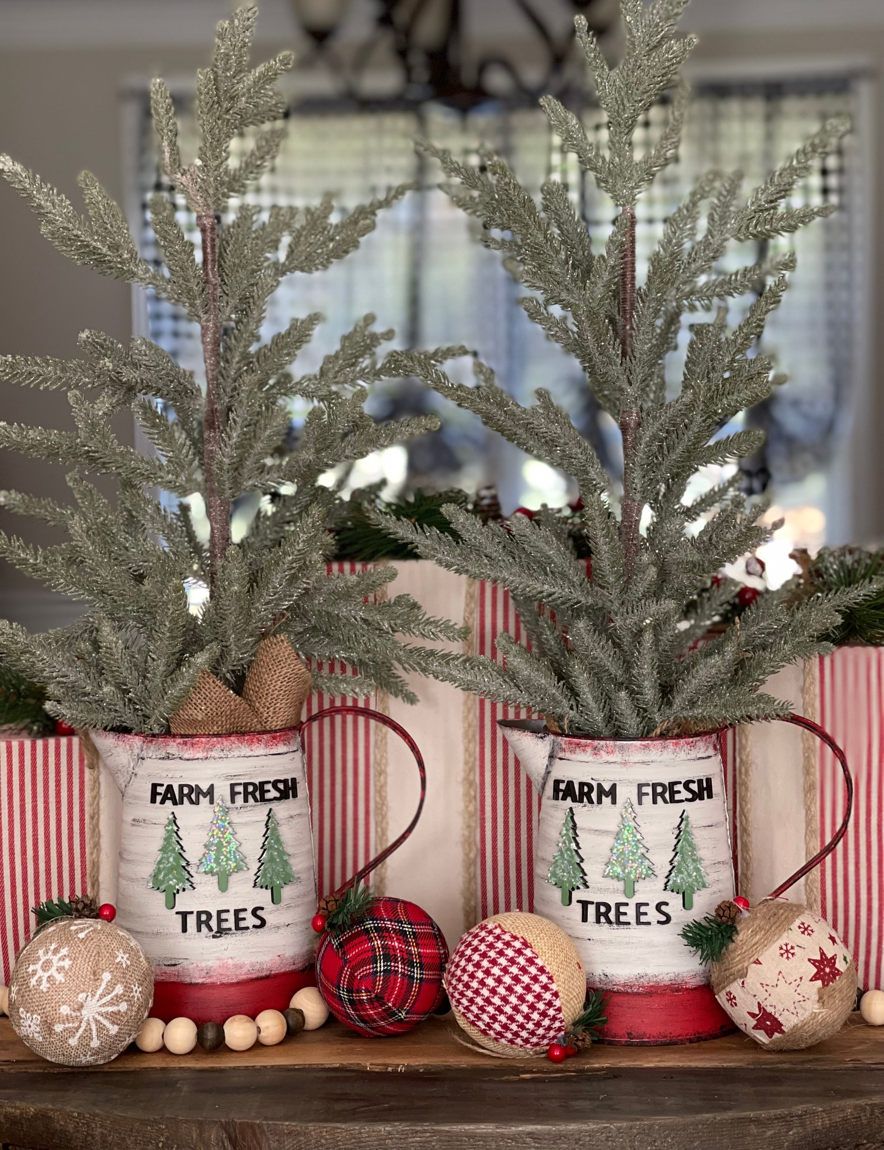 These beautiful hand made trees have hand painted metal pitchers with 3D wood cutouts that say Farm Fresh Trees with 3 wood cutouts pine trees.  They are absolutely stunning. 