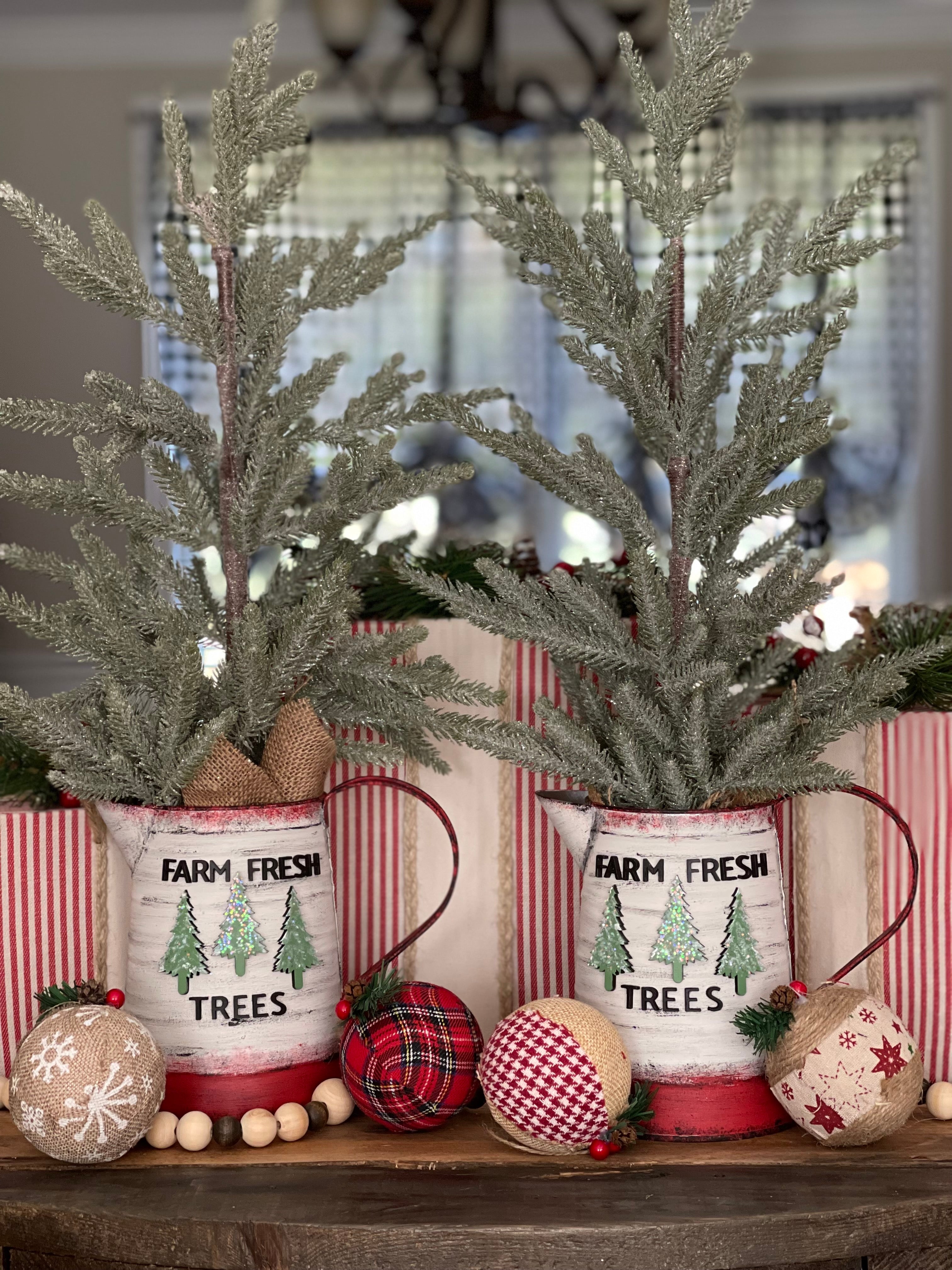 These beautiful hand made trees have hand painted metal pitchers with 3D wood cutouts that say Farm Fresh Trees with 3 wood cutouts pine trees.  They are absolutely stunning. 