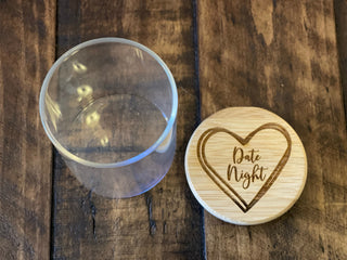 This image shows the jar and the engraved lid that says date night with heart. 
