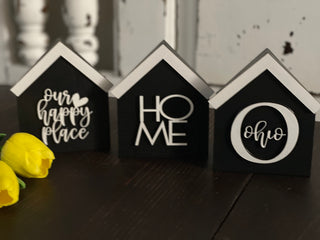 This image is of the 3 black mini houses.